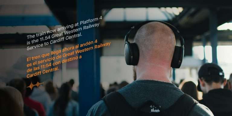 Man wearing headphones at Bristol Temple Meads Station